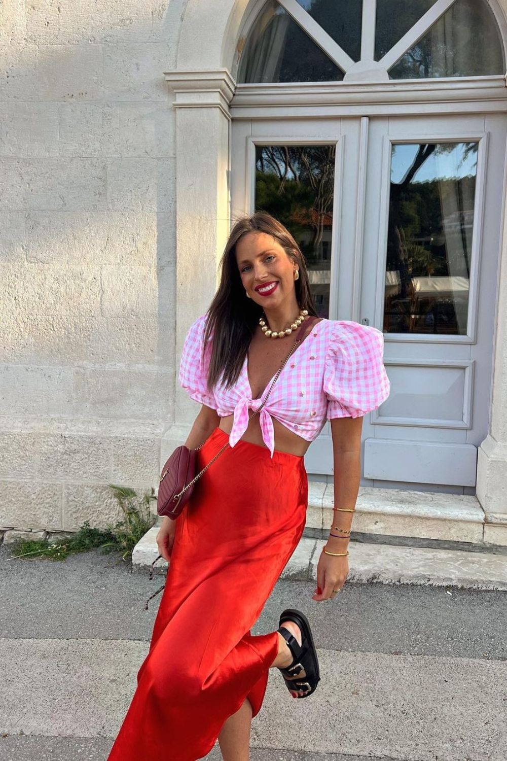 woman in red skirt and pink shirt