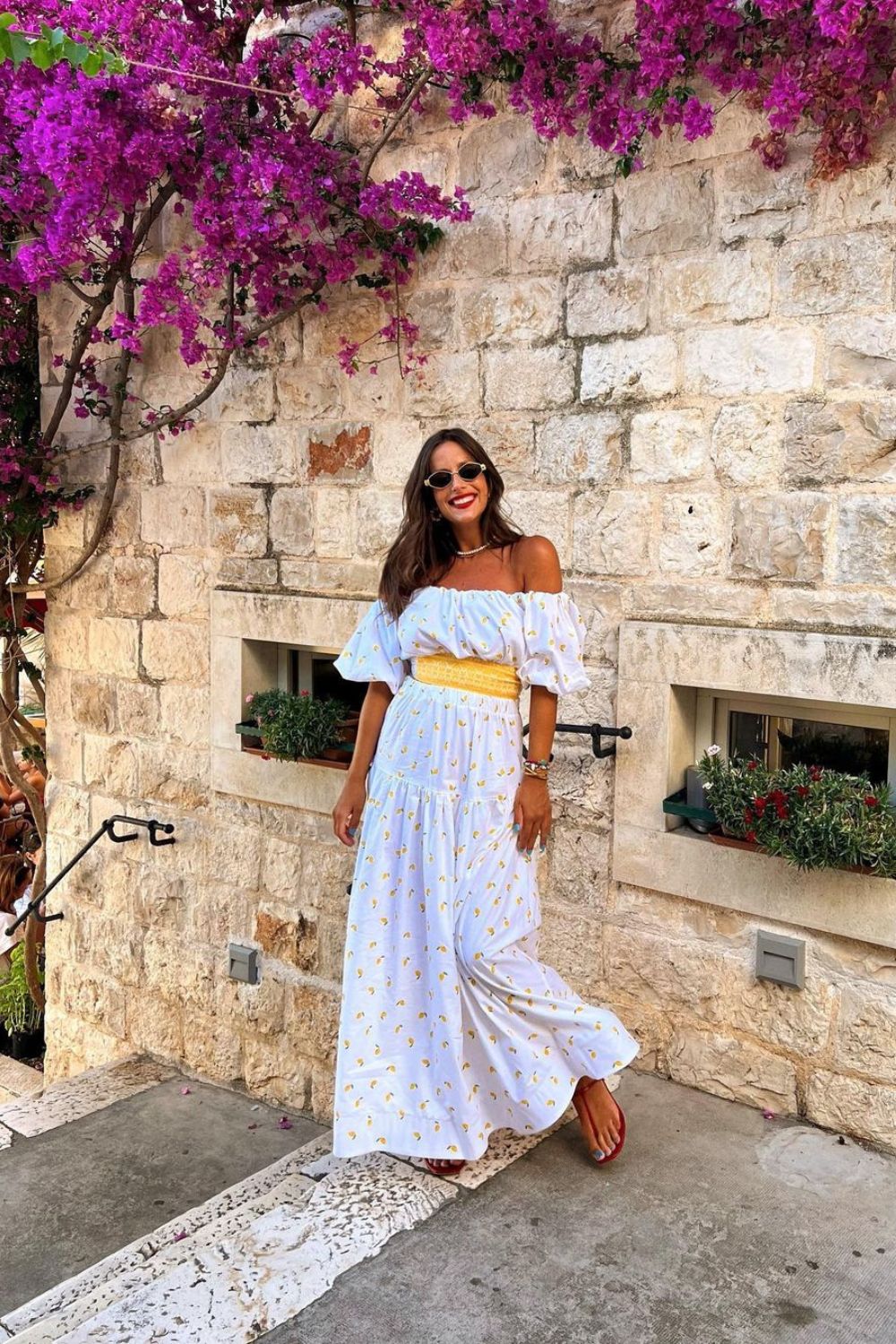 woman posing in maxi white dress