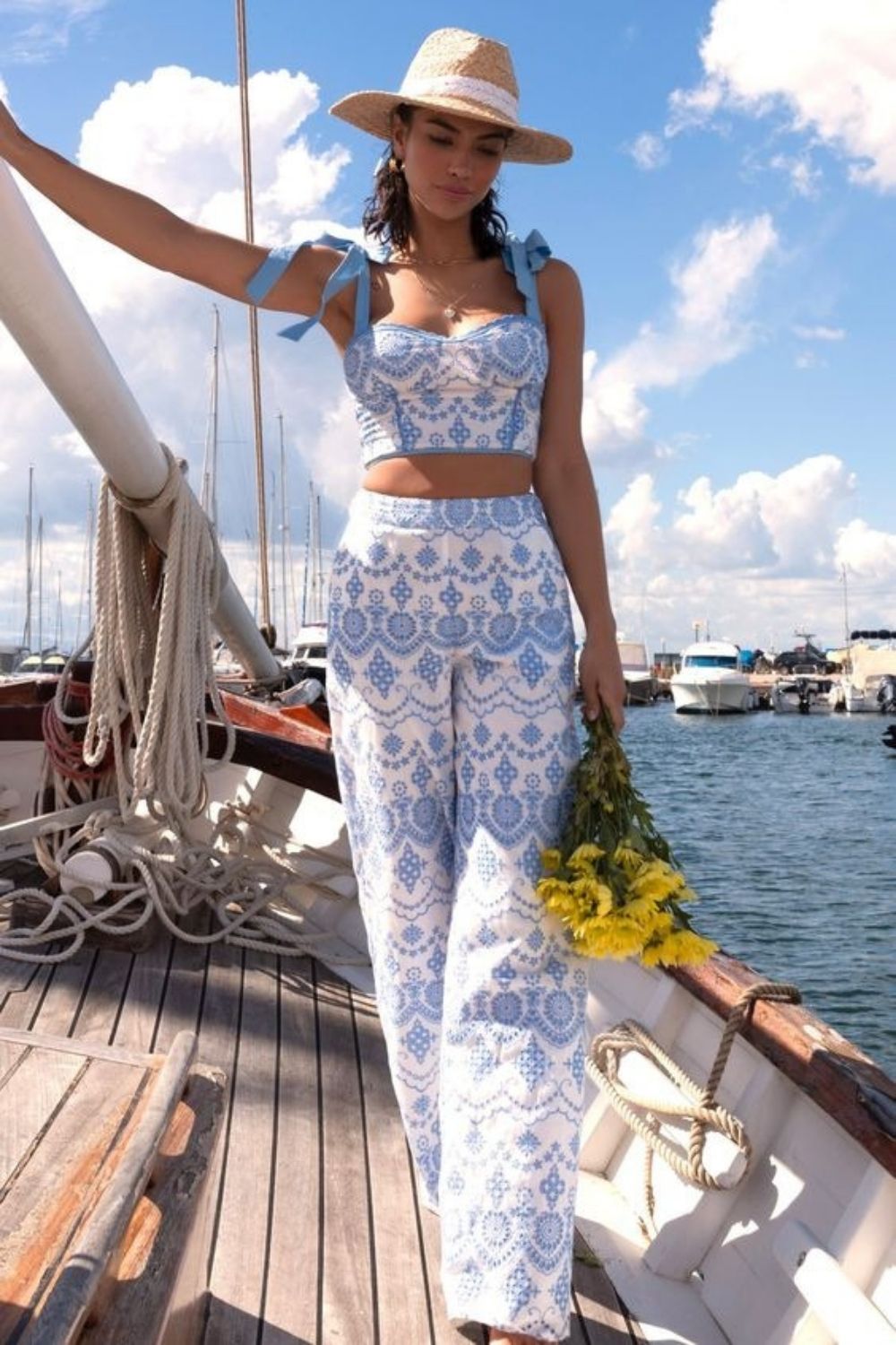 woman wearing white and blue two piece set