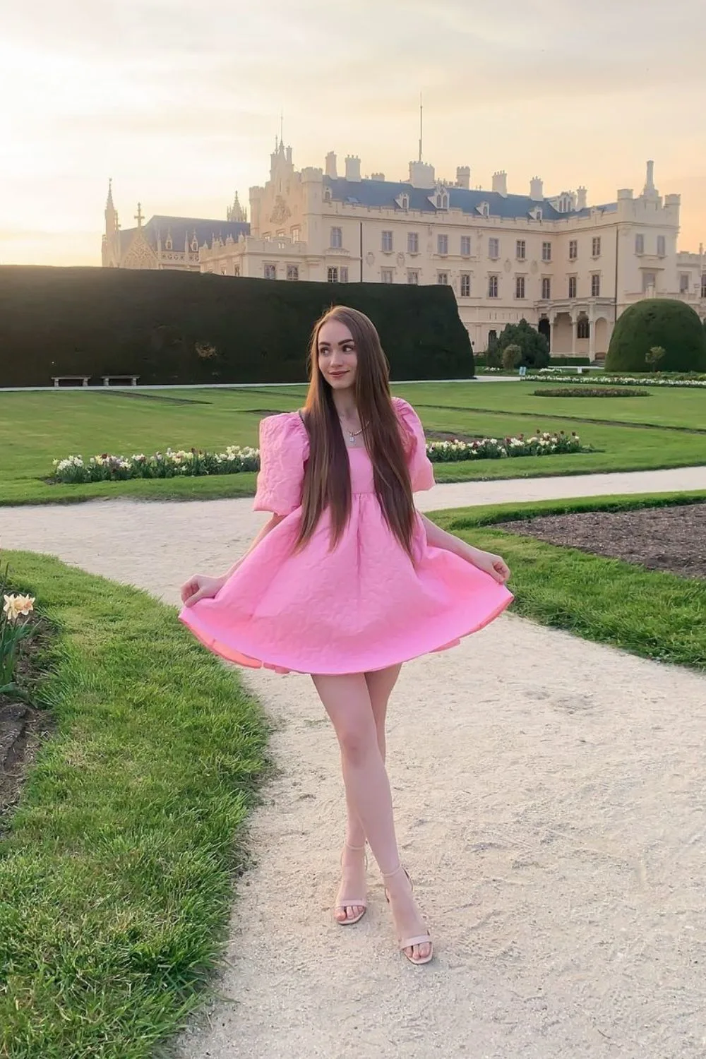 young woman in a pink mini dress