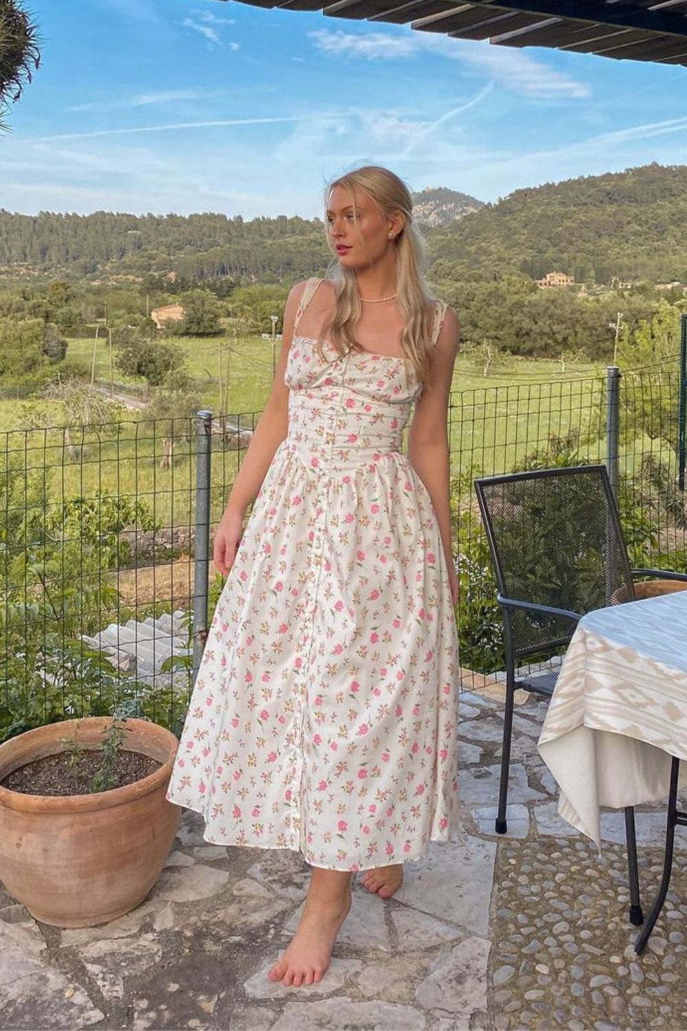 young woman in white dress without shoes