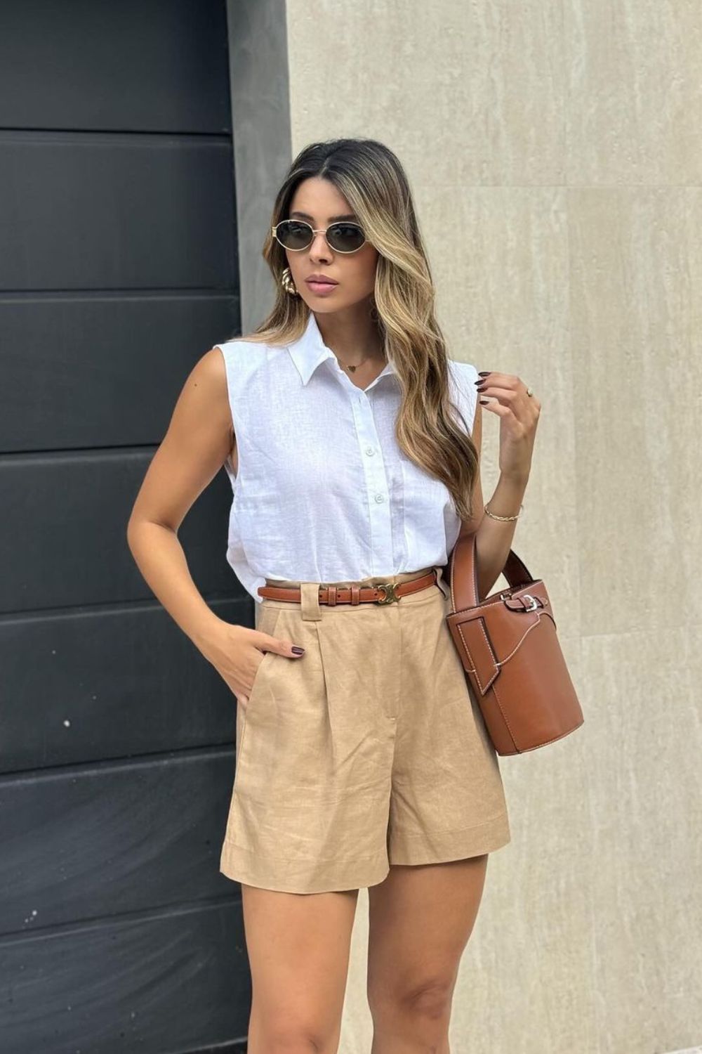 Beige shorts and sleeveless button-up