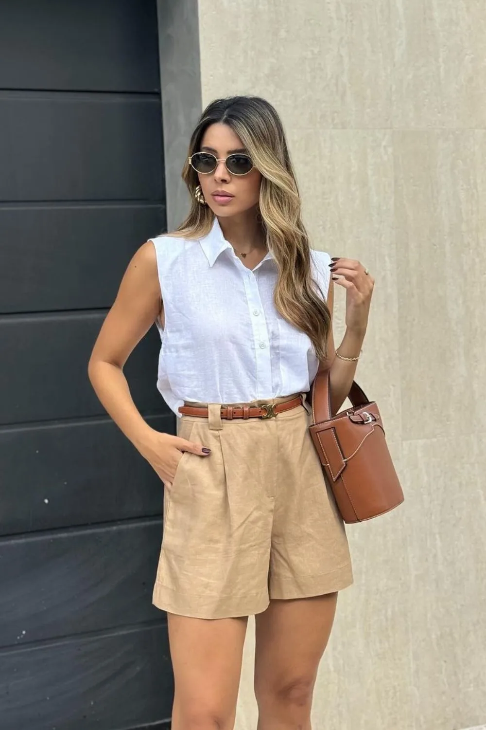 Beige shorts and sleeveless button-up