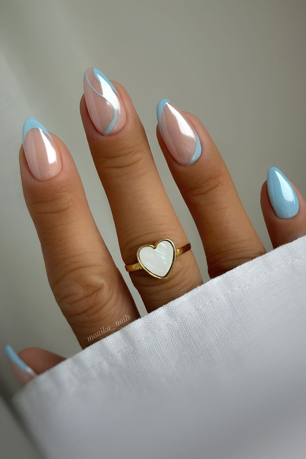 Blue nails with swirls and chrome finish