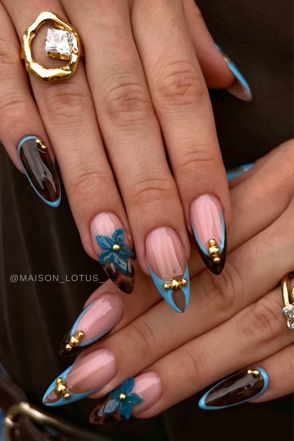 Brown and blue nails with textured floral art