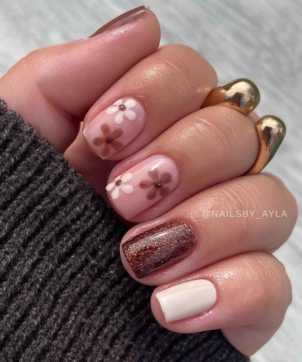 Brown and white mani with flowers and glitter