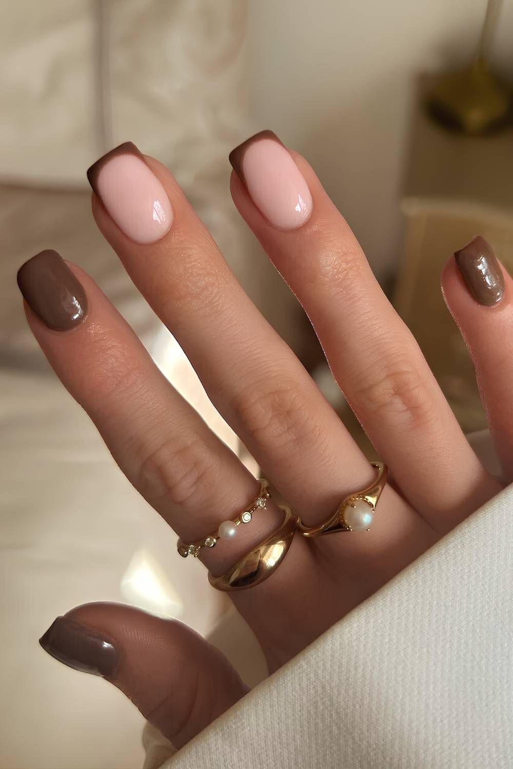 Brown manicure with accent French tips