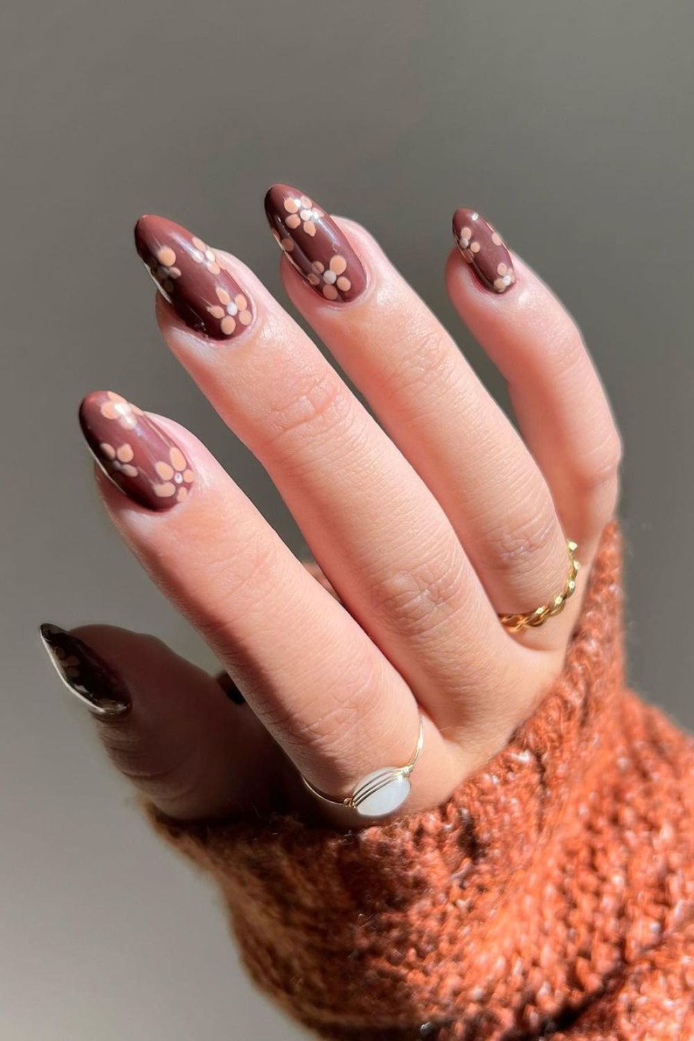 Brown nails with cream flowers