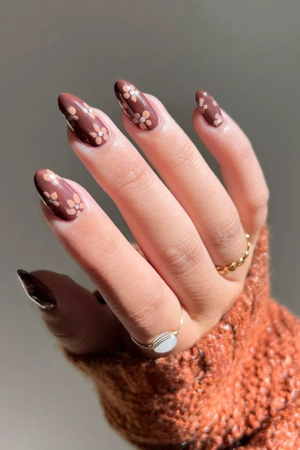 Brown nails with cream flowers