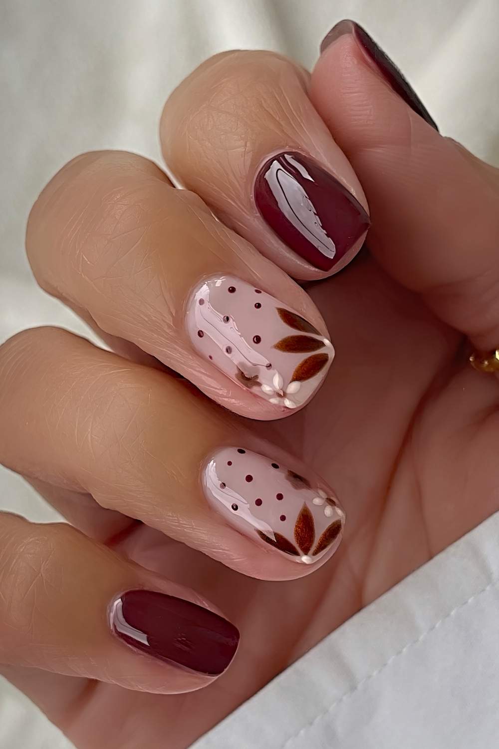 Brown nails with flower and leaf art