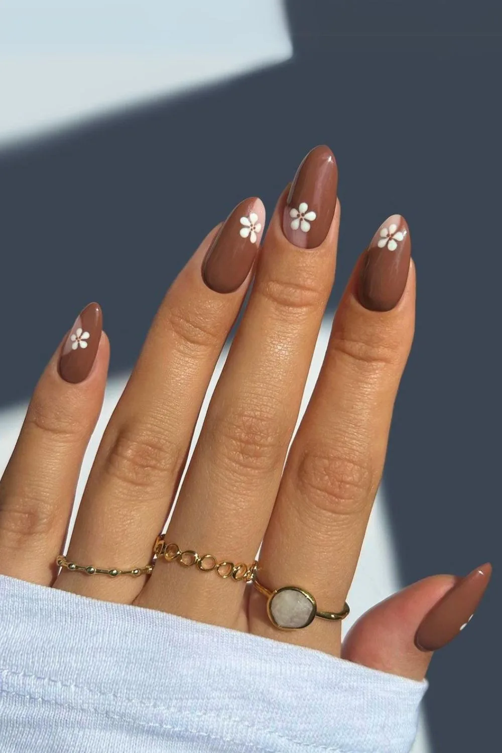 Brown nails with white flowers