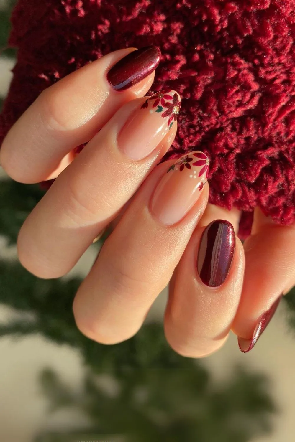 Burgundy nails with floral accents