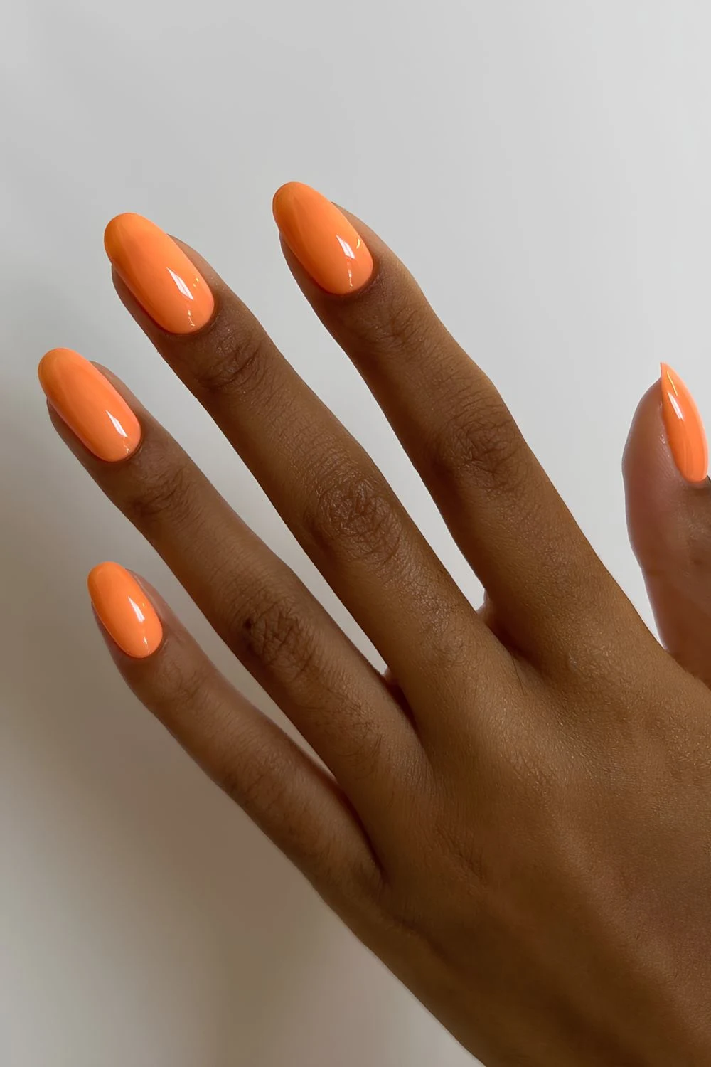 Creamy neon orange nails