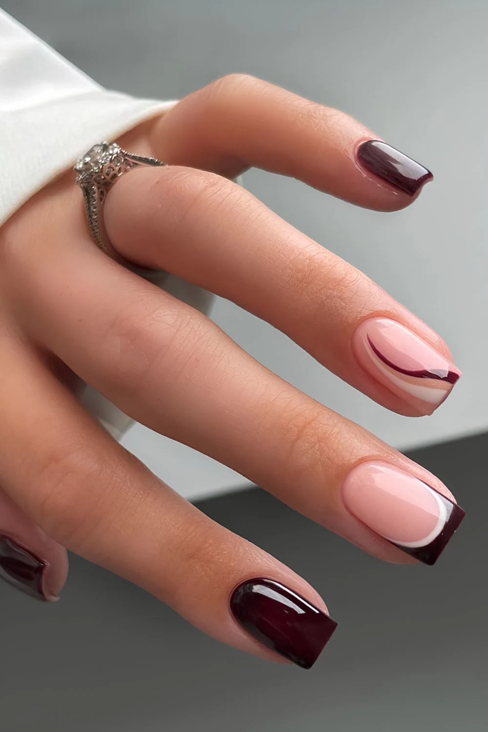 Dark brown mani with accent lines