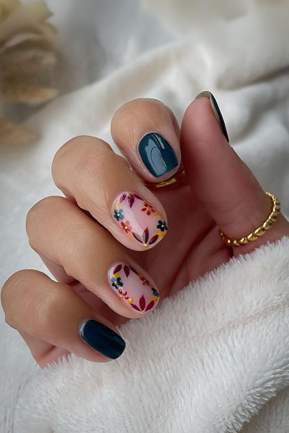 Dark green floral manicure