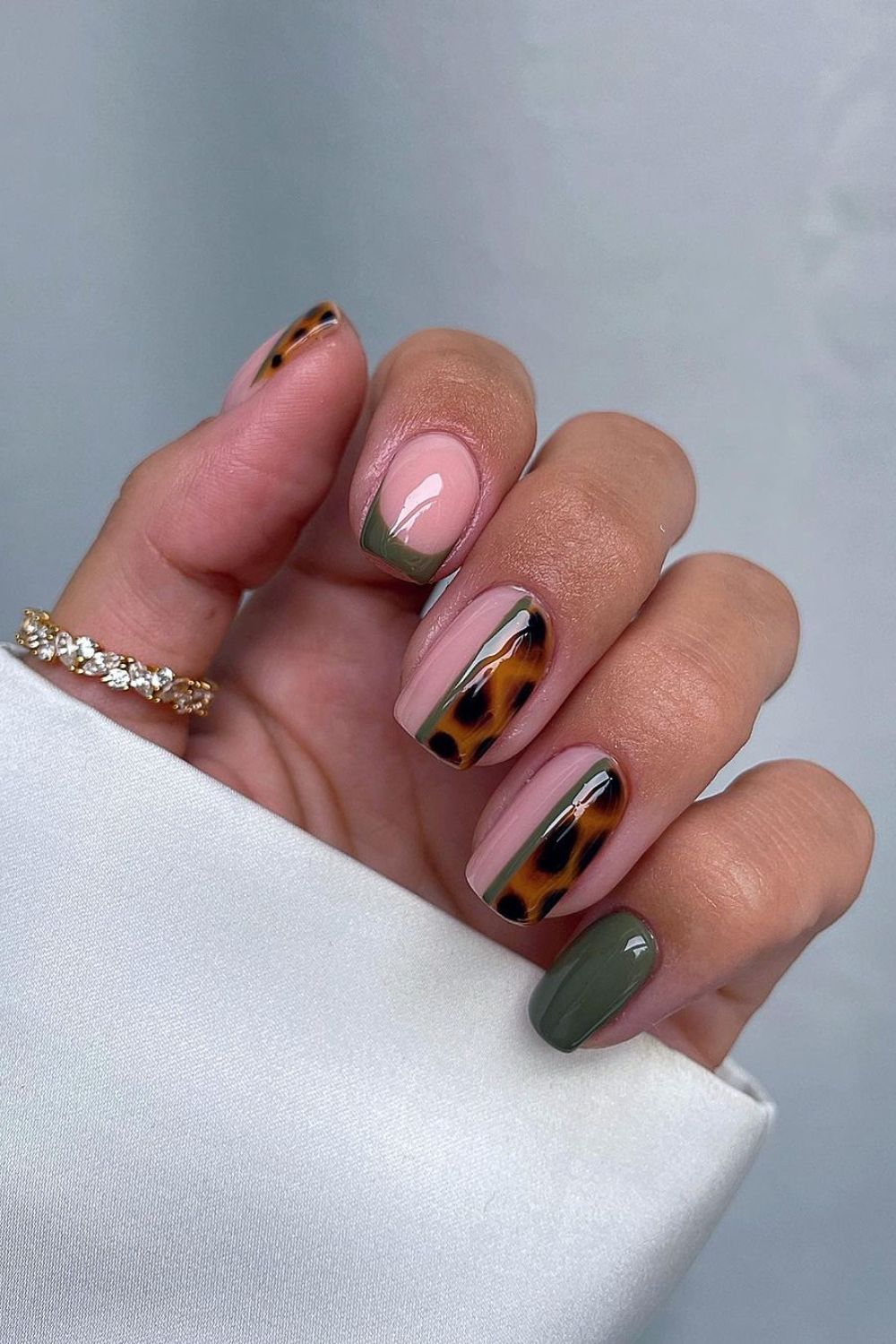 Dark green mani with tortoise shell accent