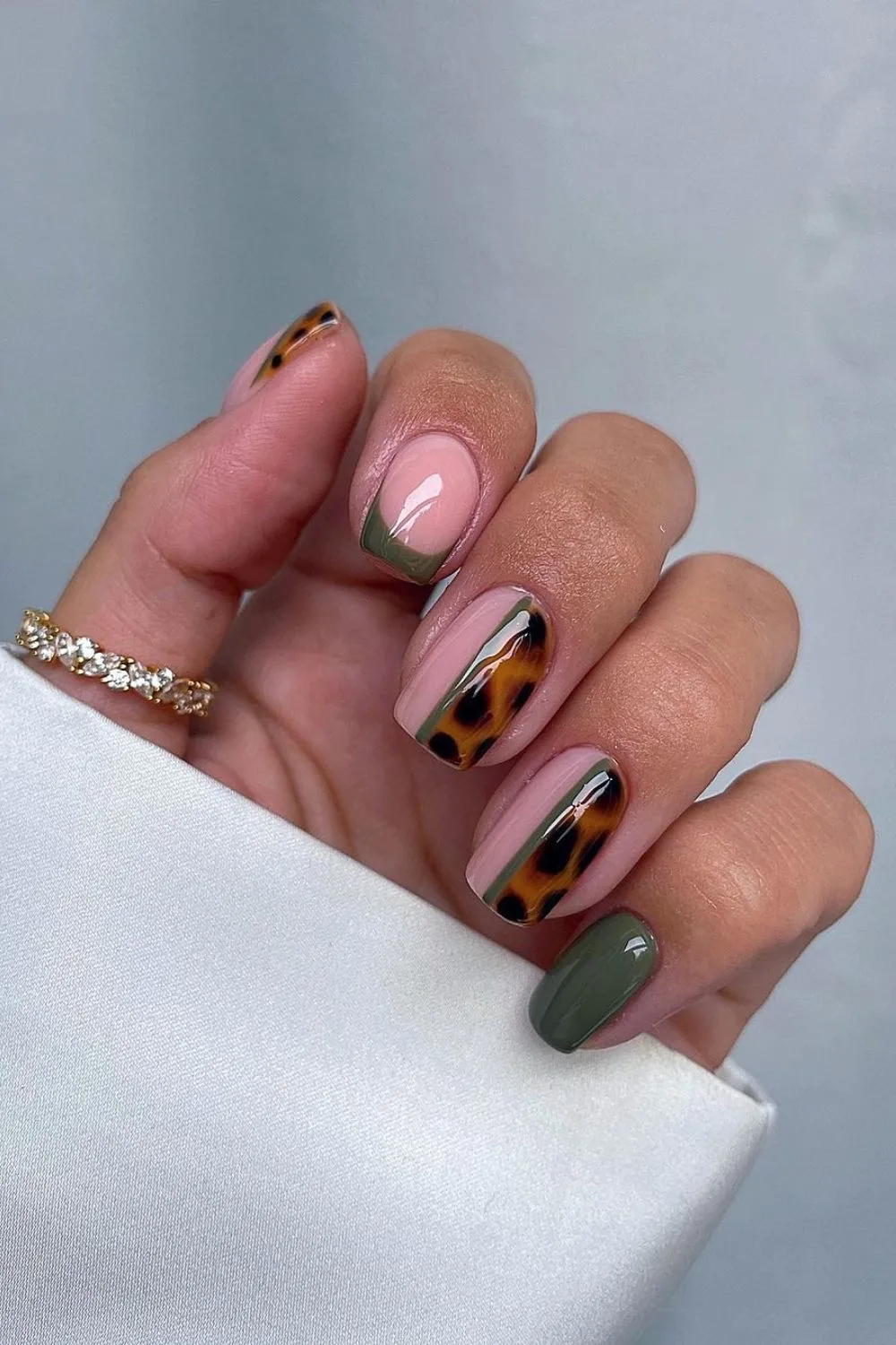 Dark green mani with tortoise shell accent