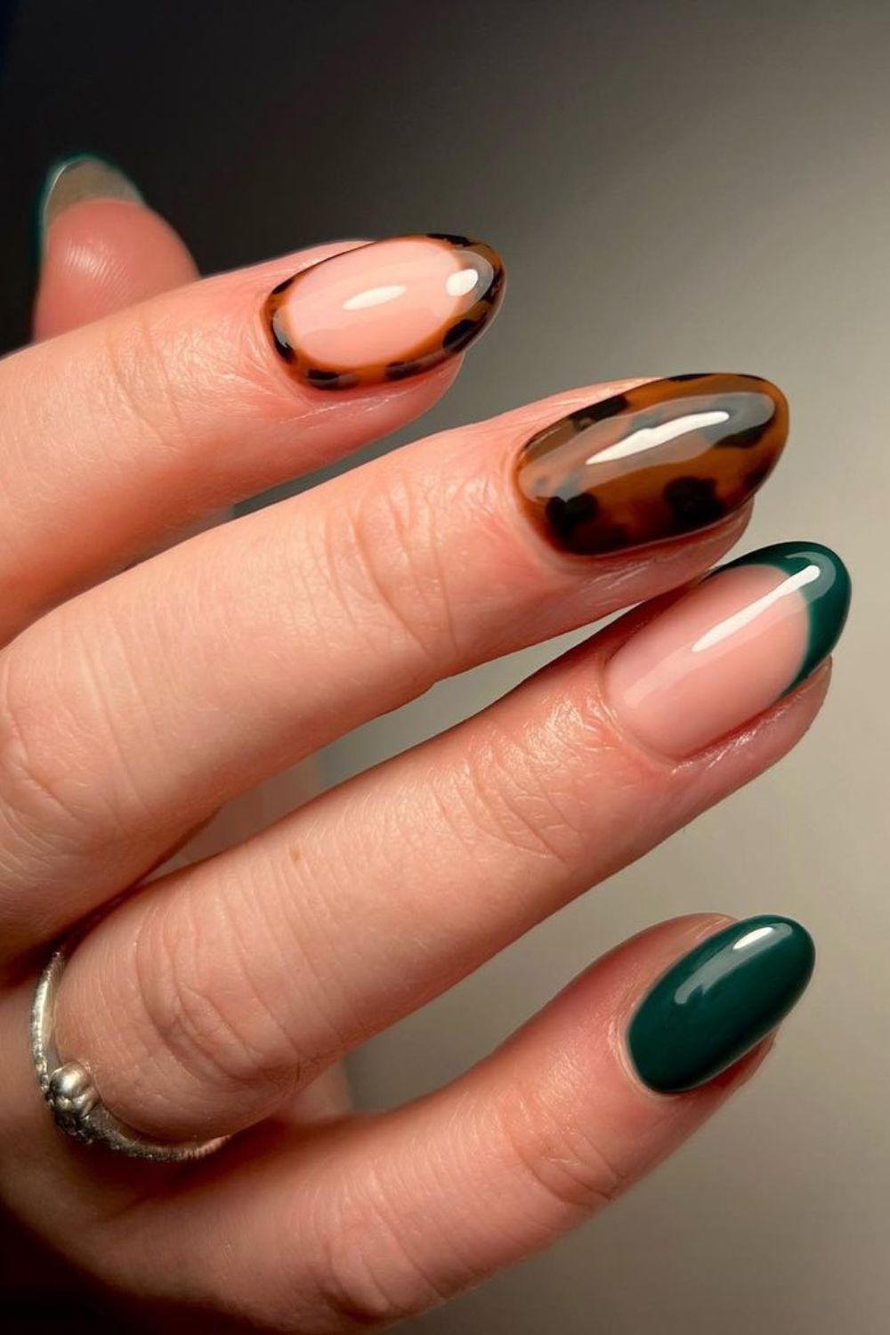 Dark green nails with tortoise shell accent