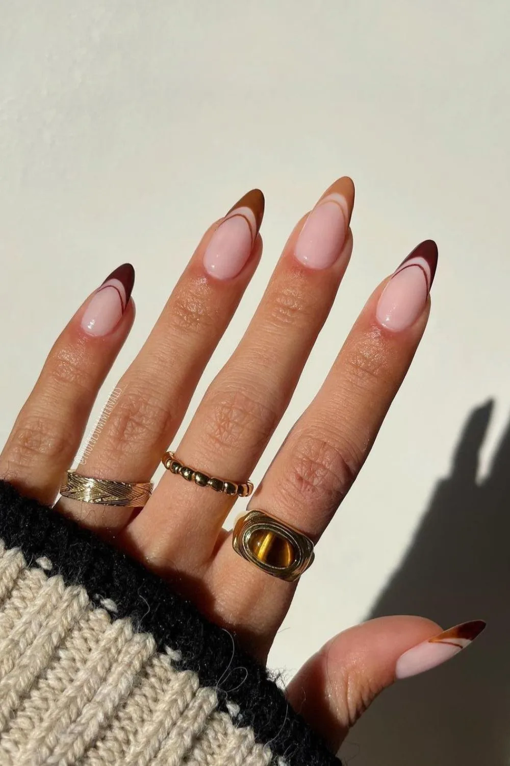 Double French tip nails in different shades of brown