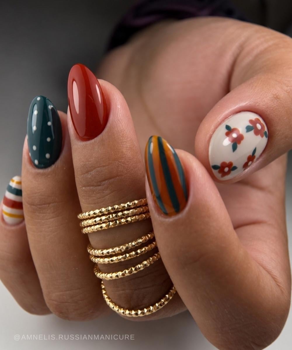 Earthy skittle nails with flowers and stripes