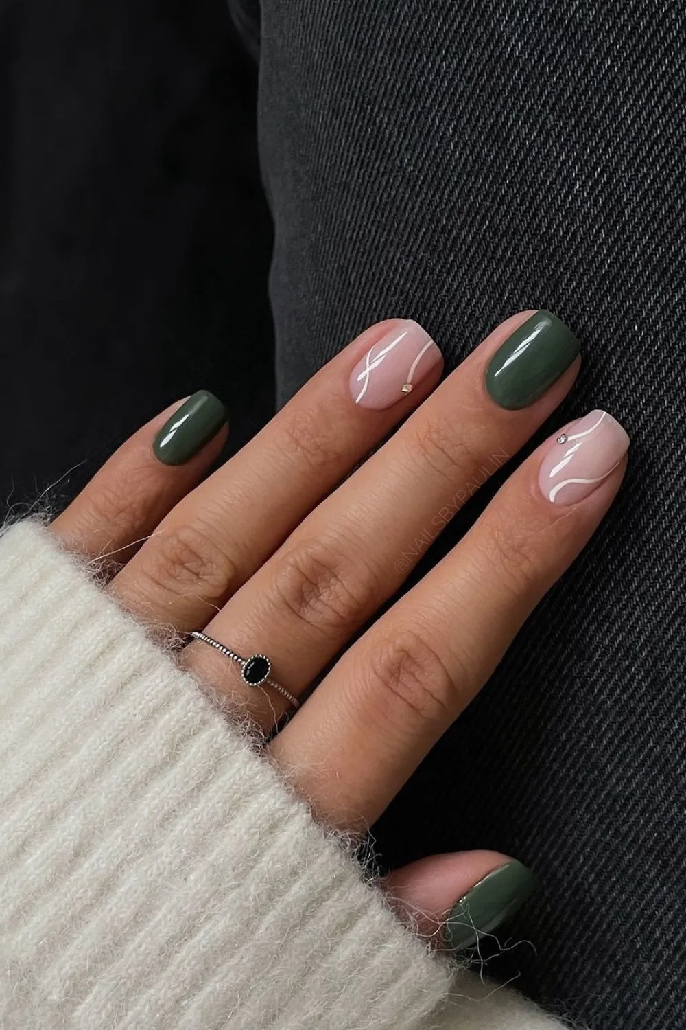 Forest green nails with white swirls and studs