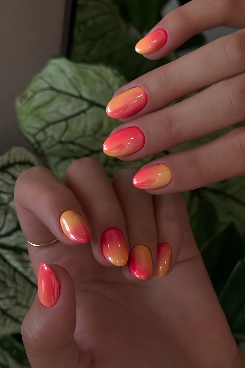 Glazed orange to coral red sunset inspired gradient nails