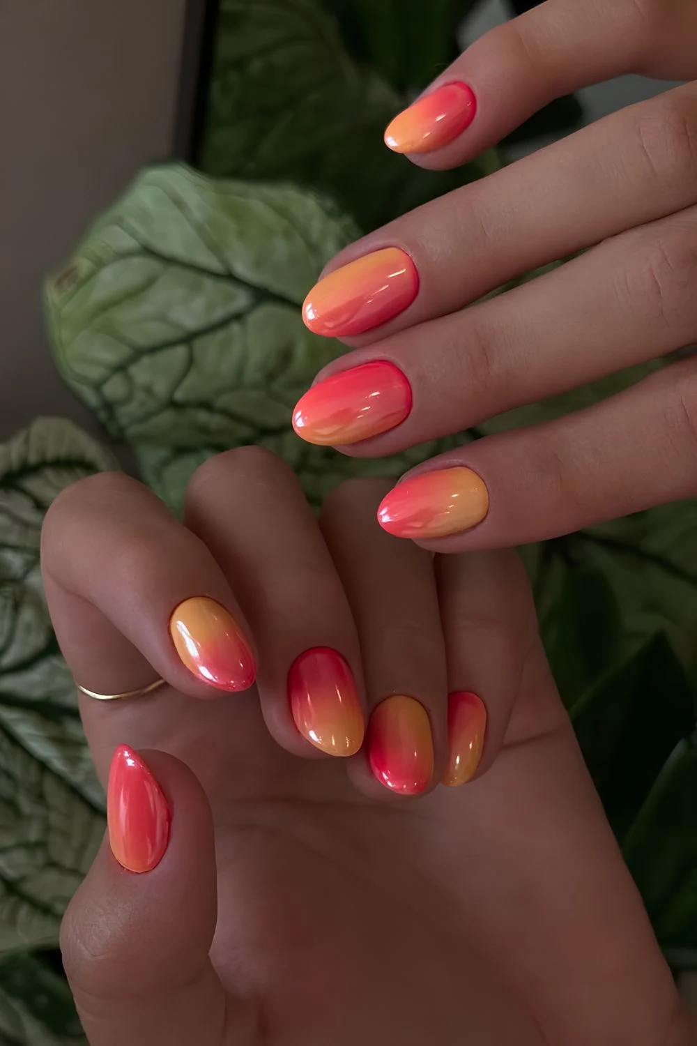 Glazed orange to coral red sunset inspired gradient nails