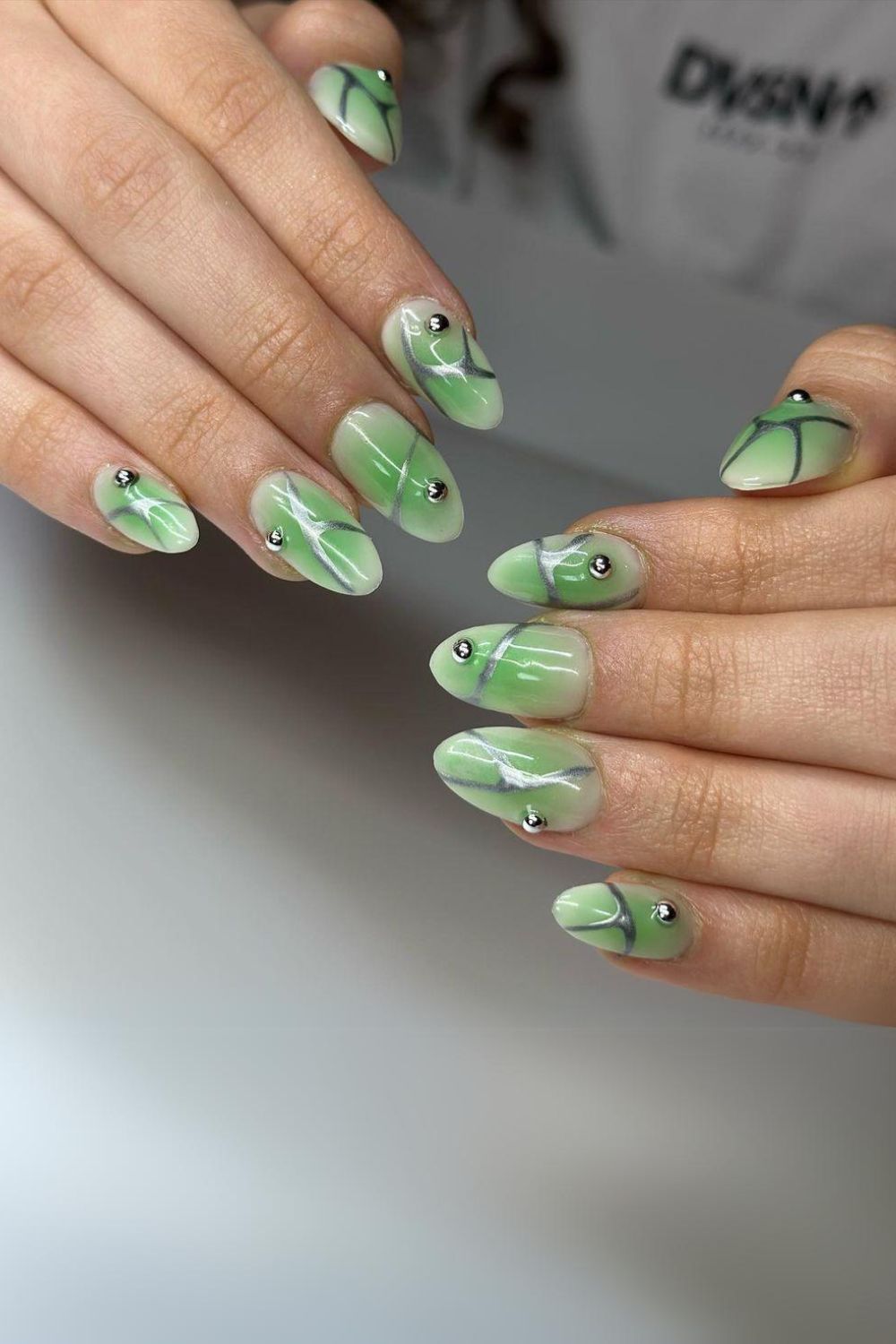 Jade green nails with silver accents