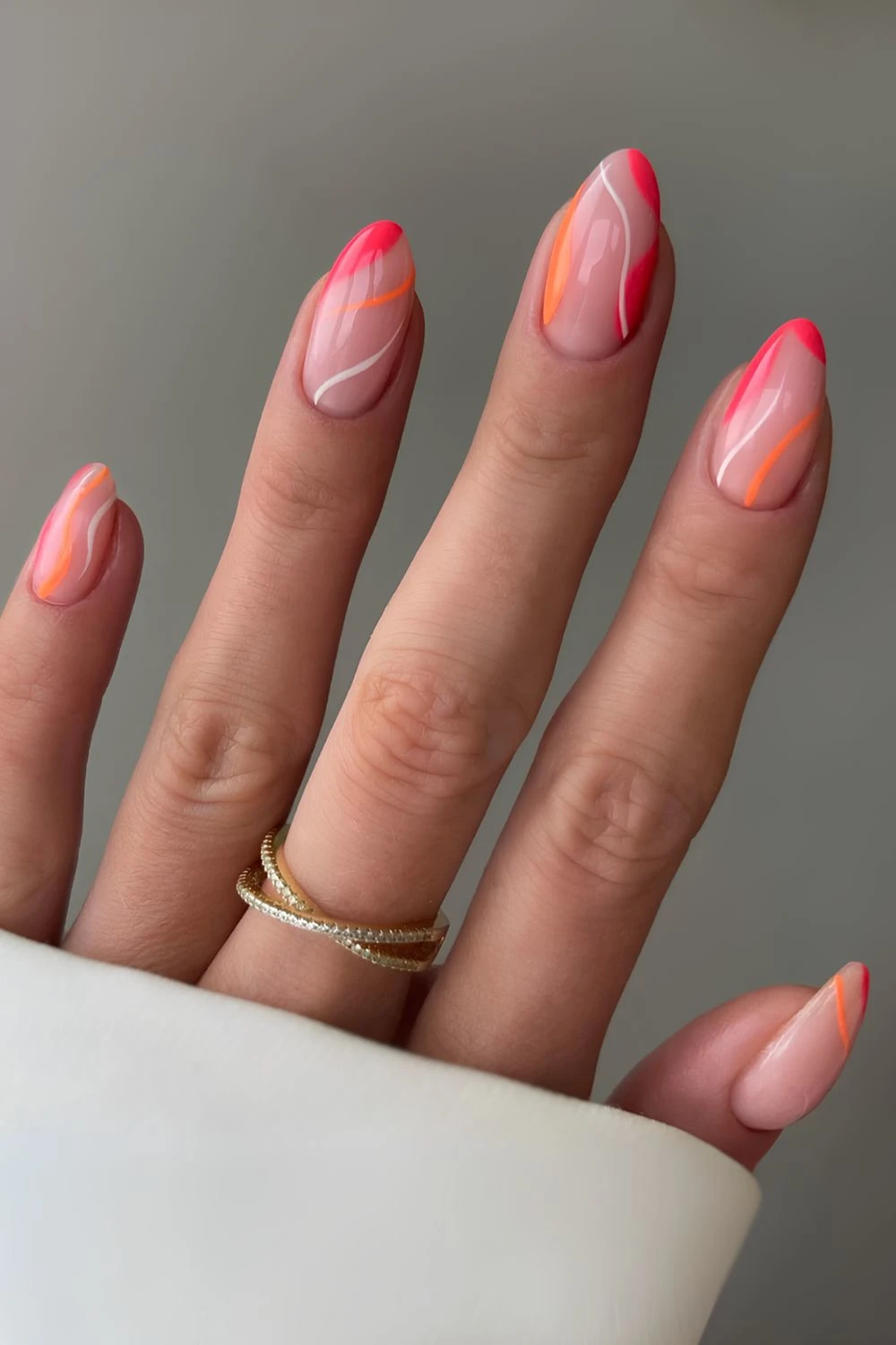 Milky nails with abstract pink and orange lines