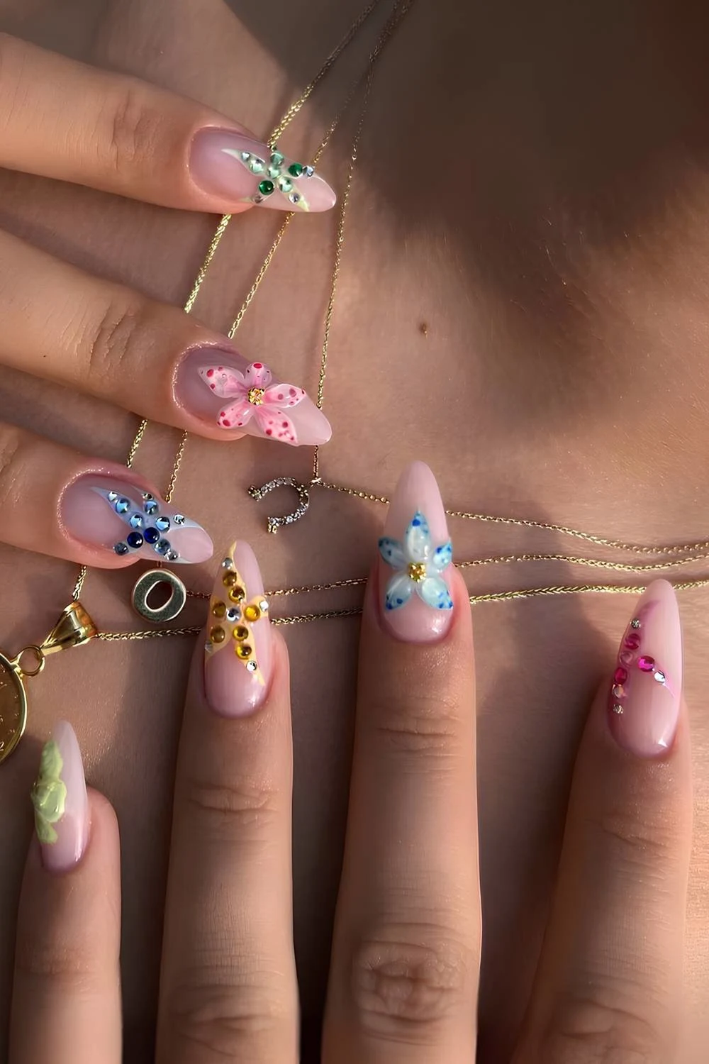 Milky pink nails with textured beach inspired art