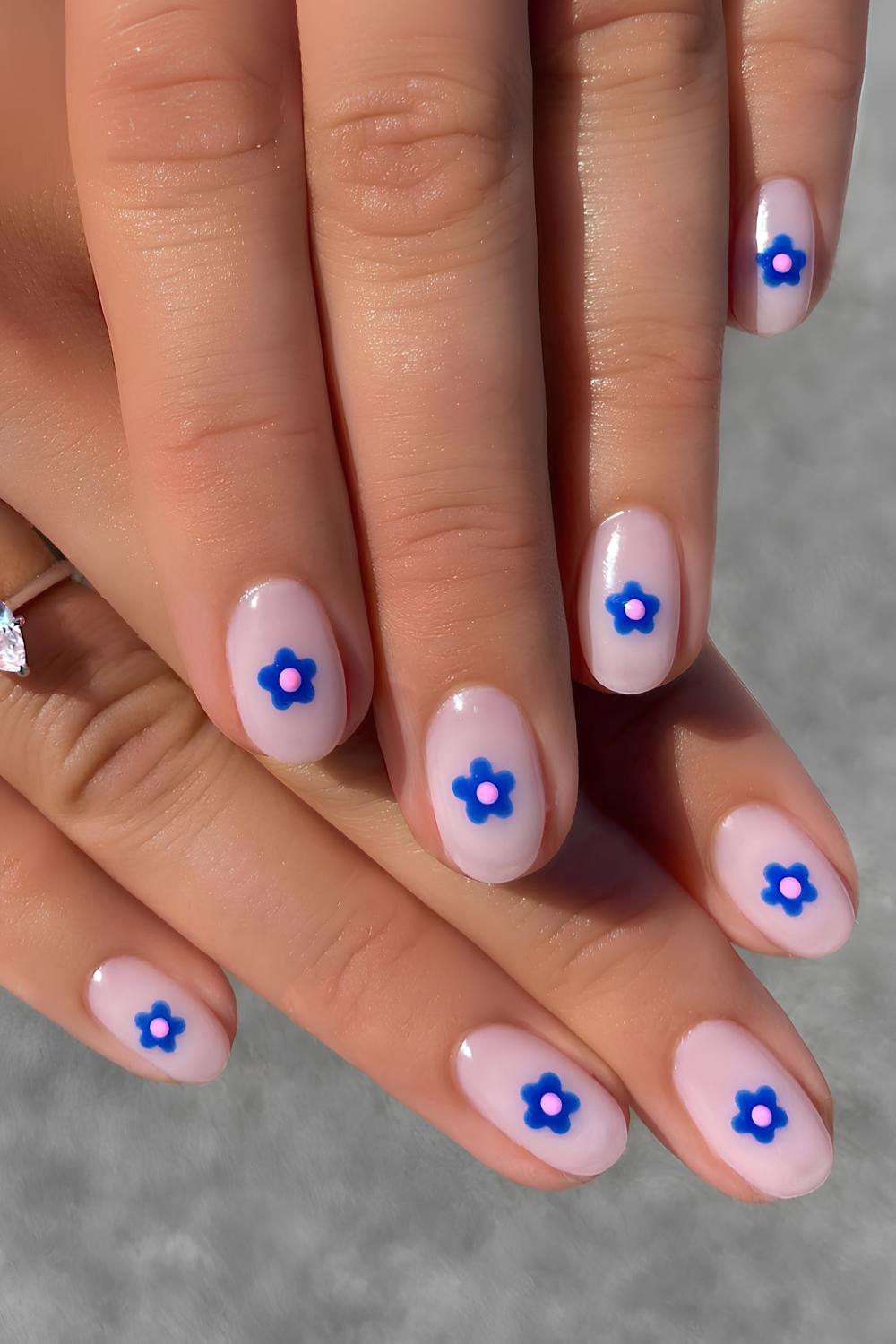 Milky white nails with blue floral art