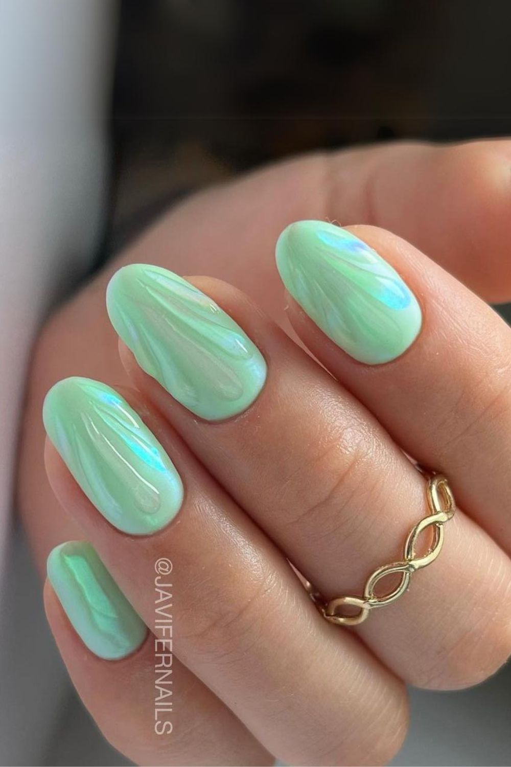 Mint green nails with glossy seashell design