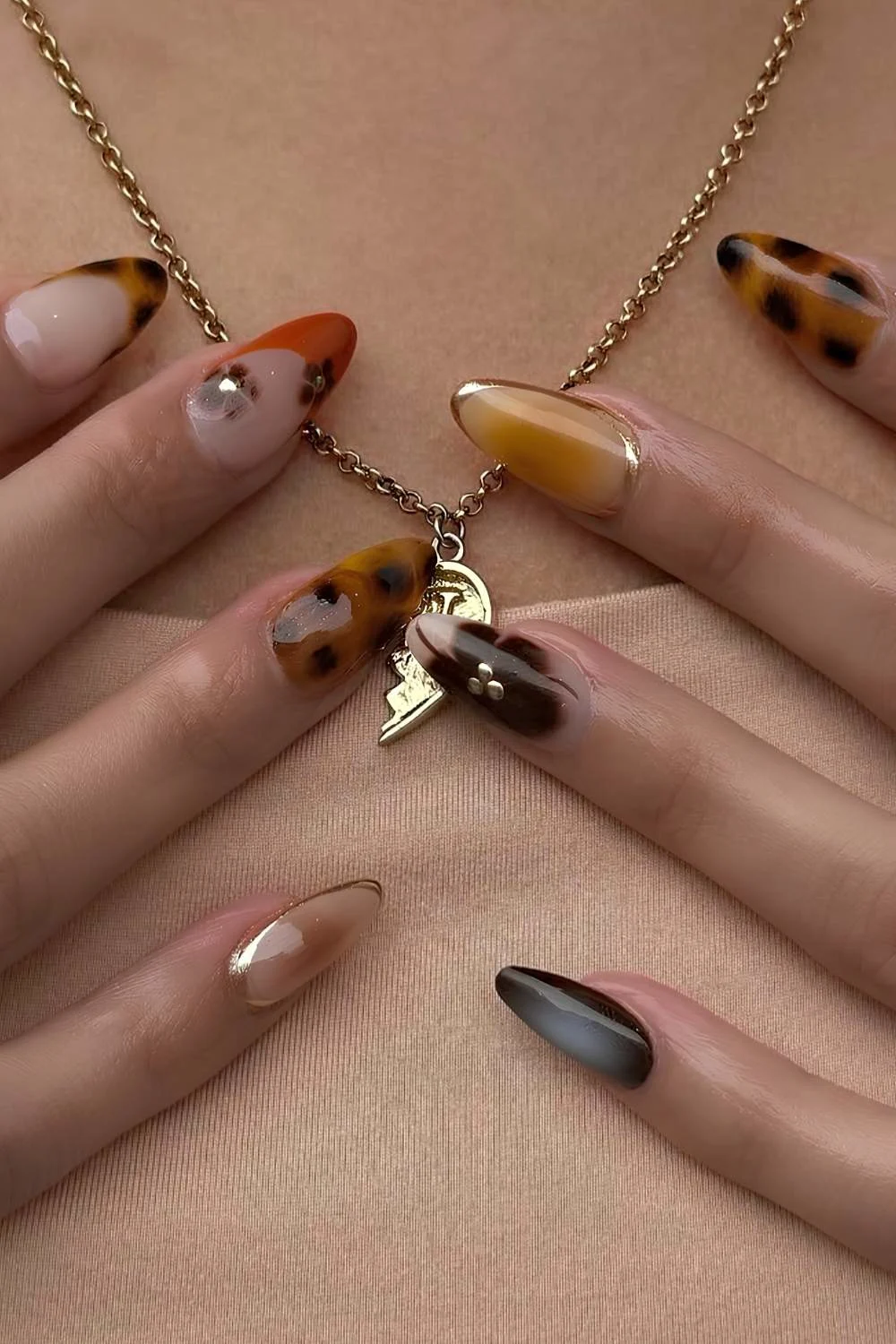 Mix and match mani with tortie shell and gold details