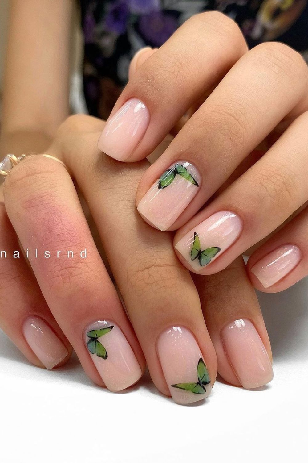 Nails with green butterflies