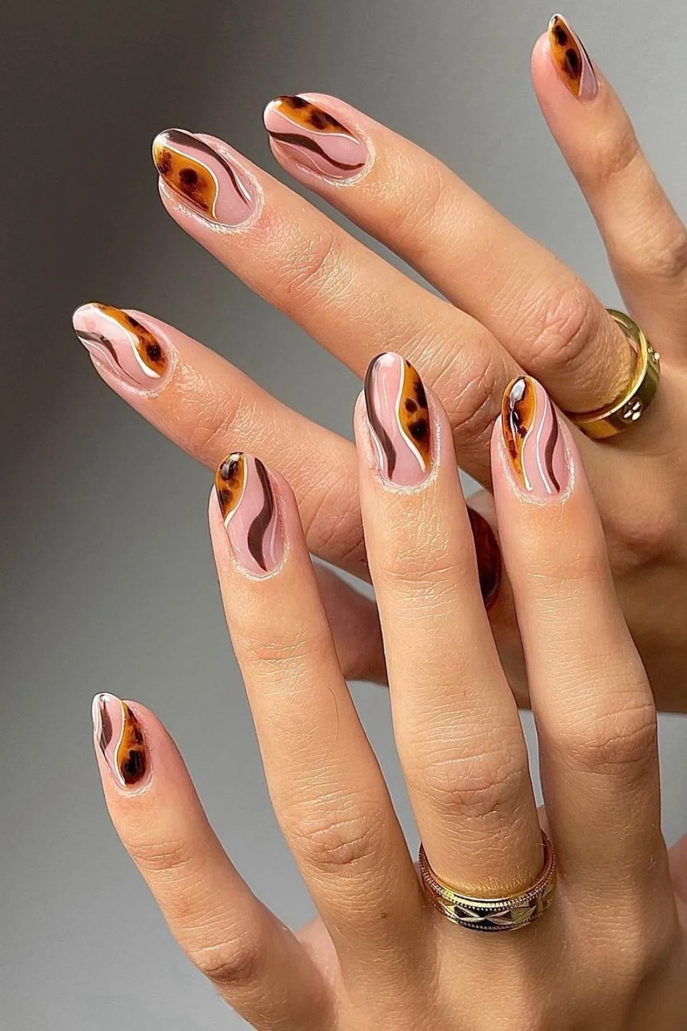 Nails with tortoise shell swirls on negative space