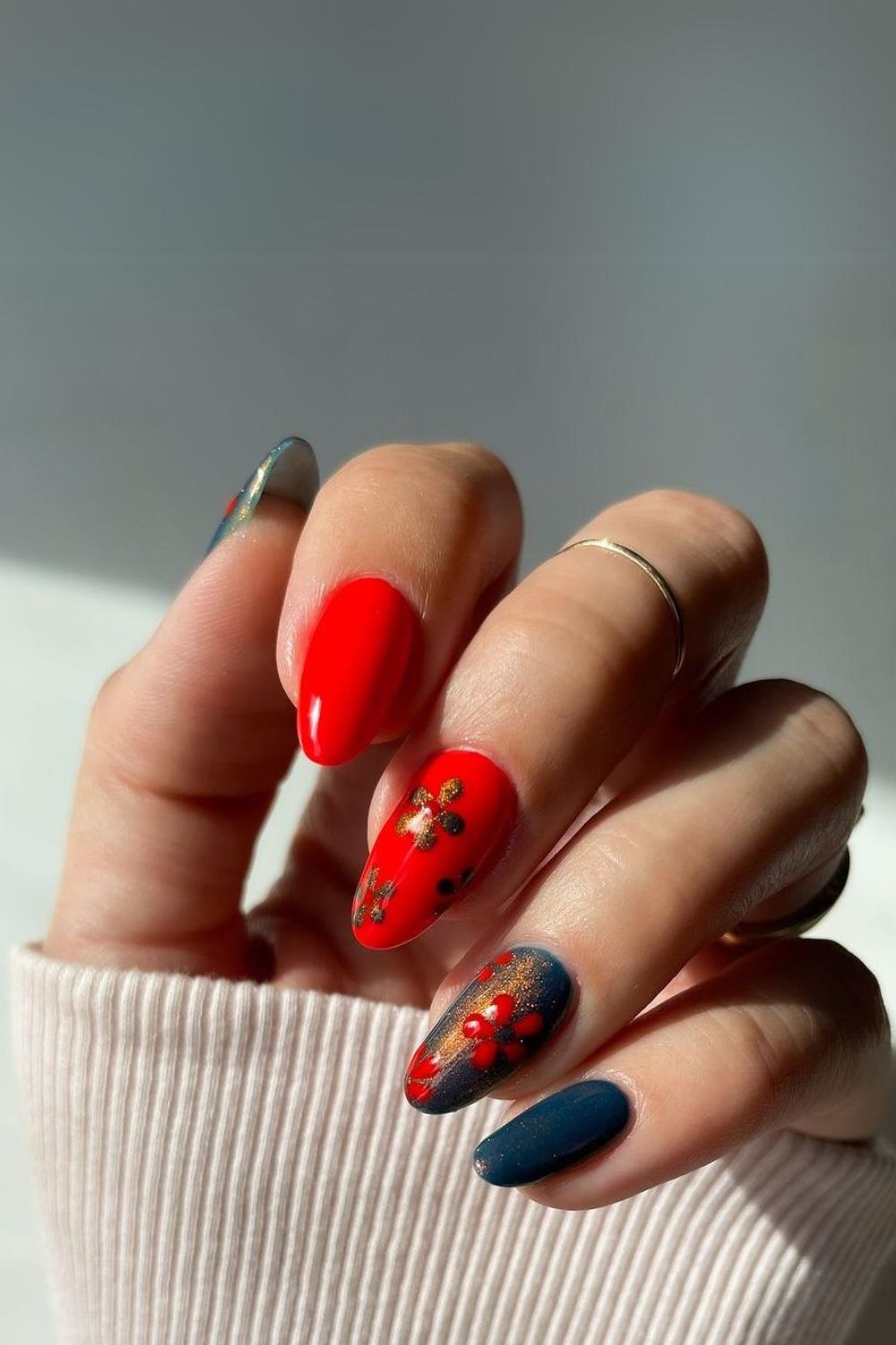 Navy and red nails with gold and flowers