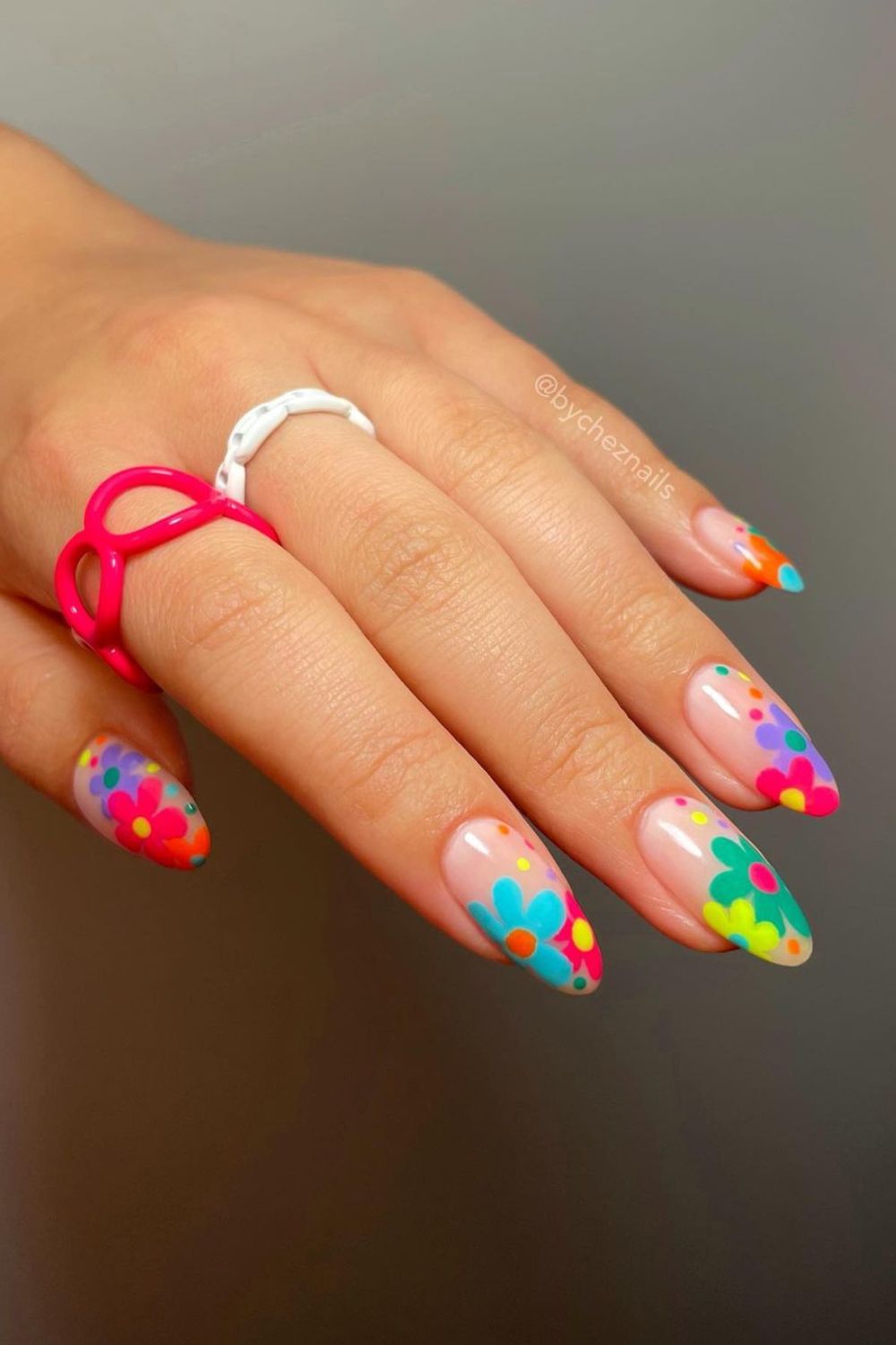 Nude nails with bold and bright flowers