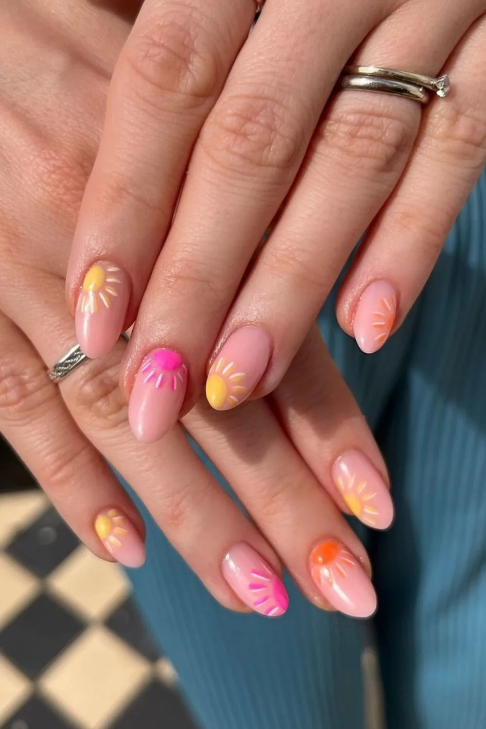 Nude nails with colorful sun designs