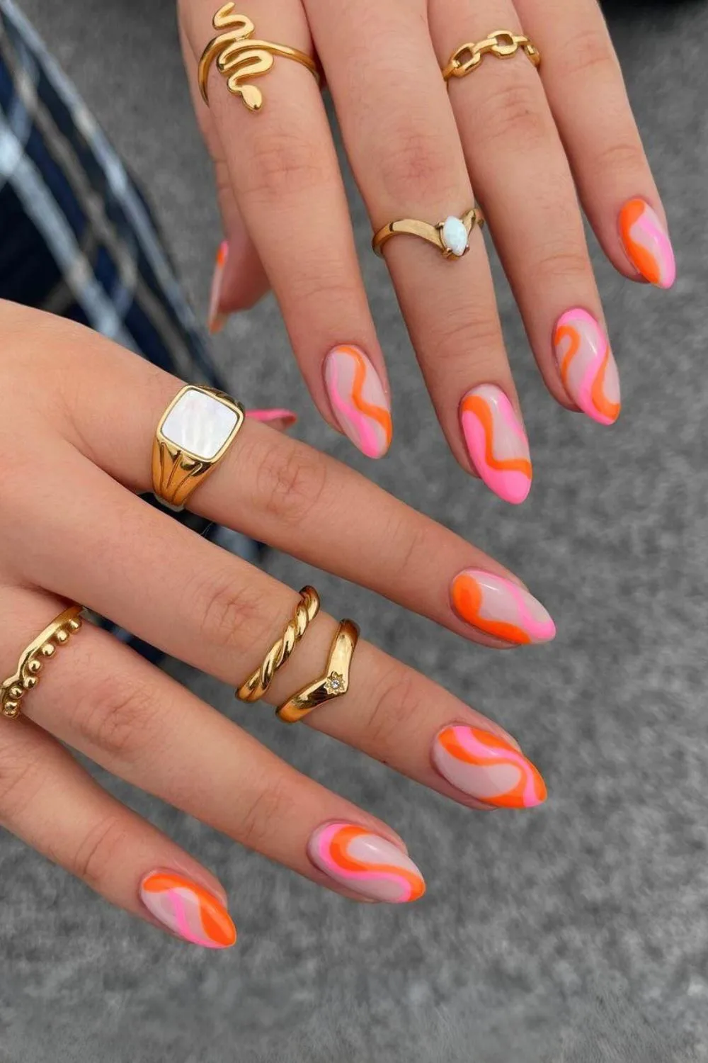 Orange and pink swirl nails