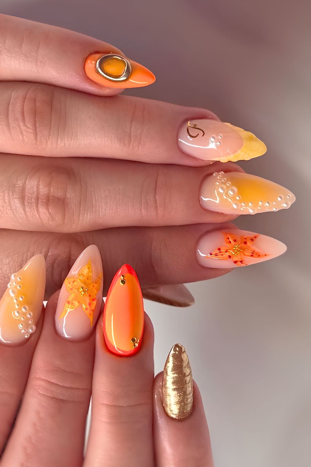 Orange mix and match beach inspired nails