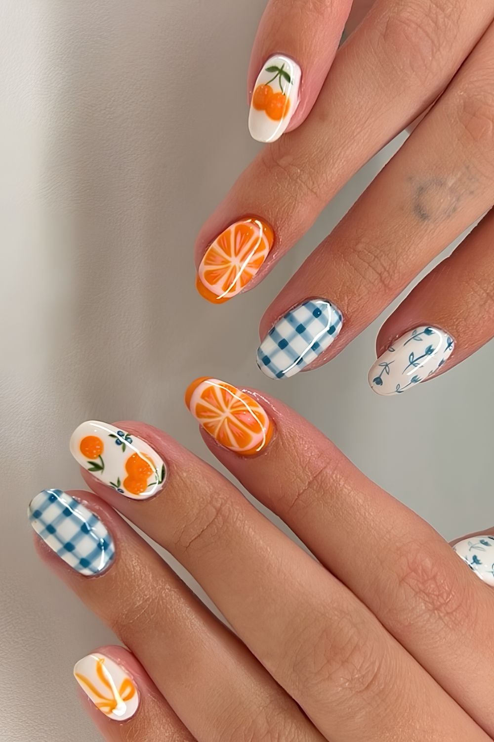 Orange white and blue picnic nails