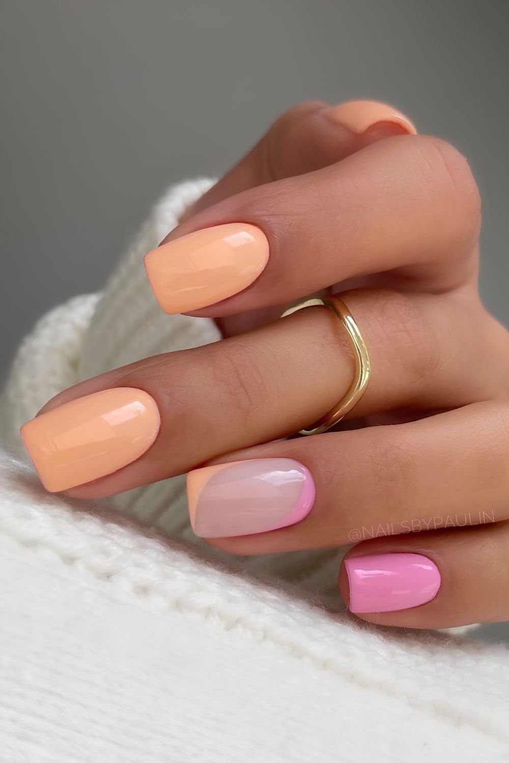 Pastel pink and orange nails with negative space