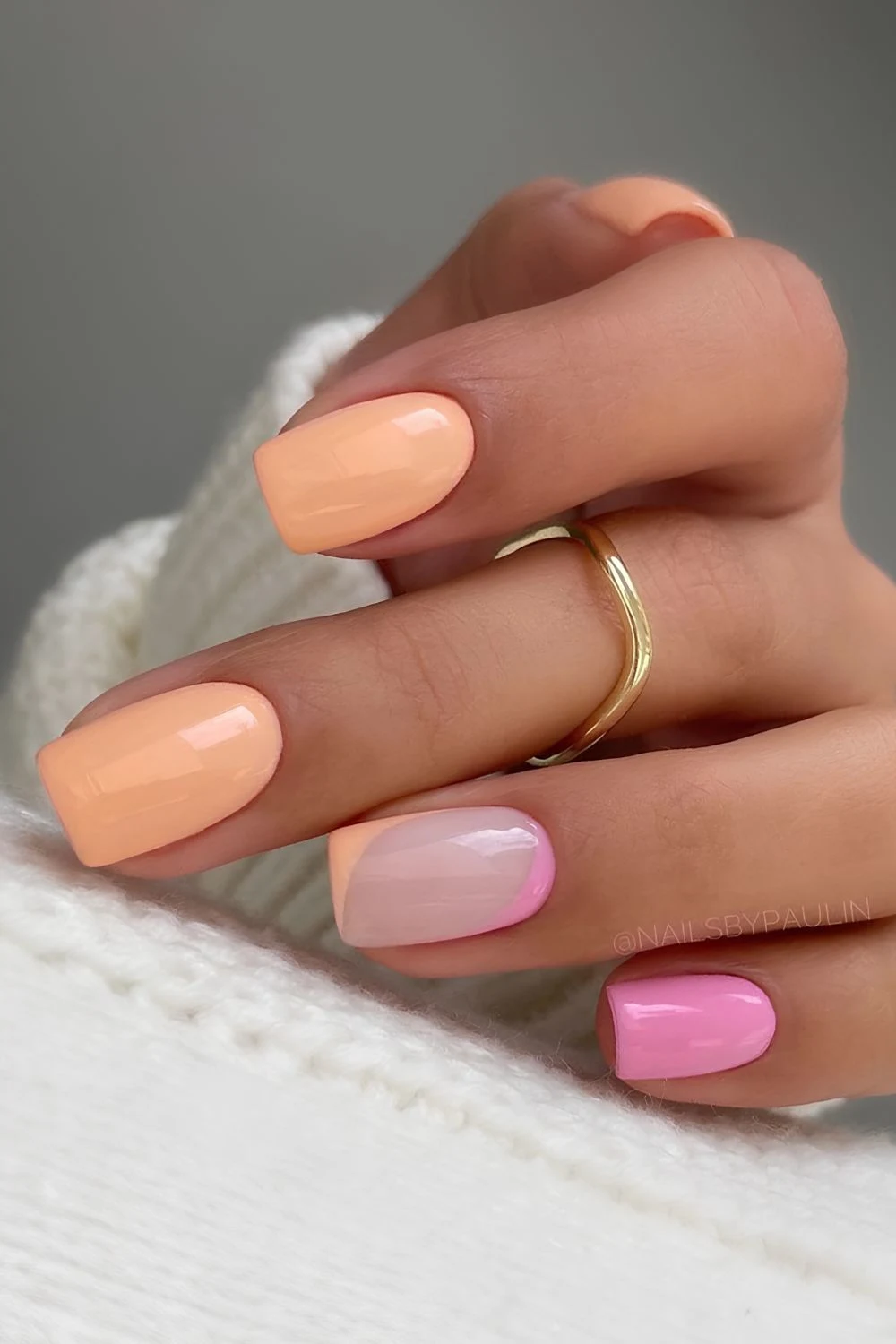 Pastel pink and orange nails with negative space