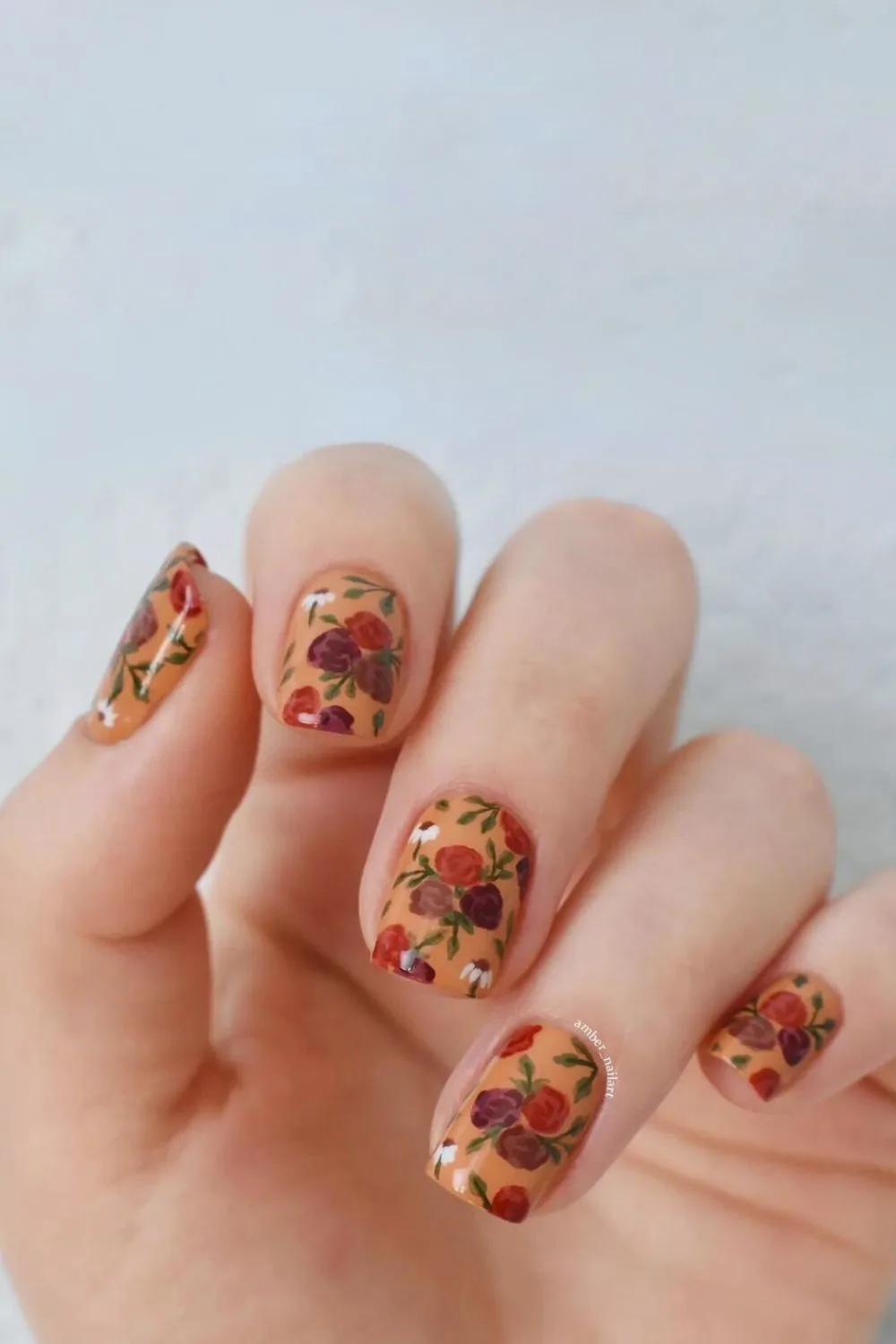 Peach Orange nails with rose accents