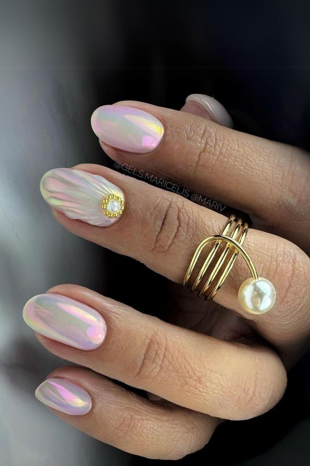 Pearlescent seashell nails with gold accent