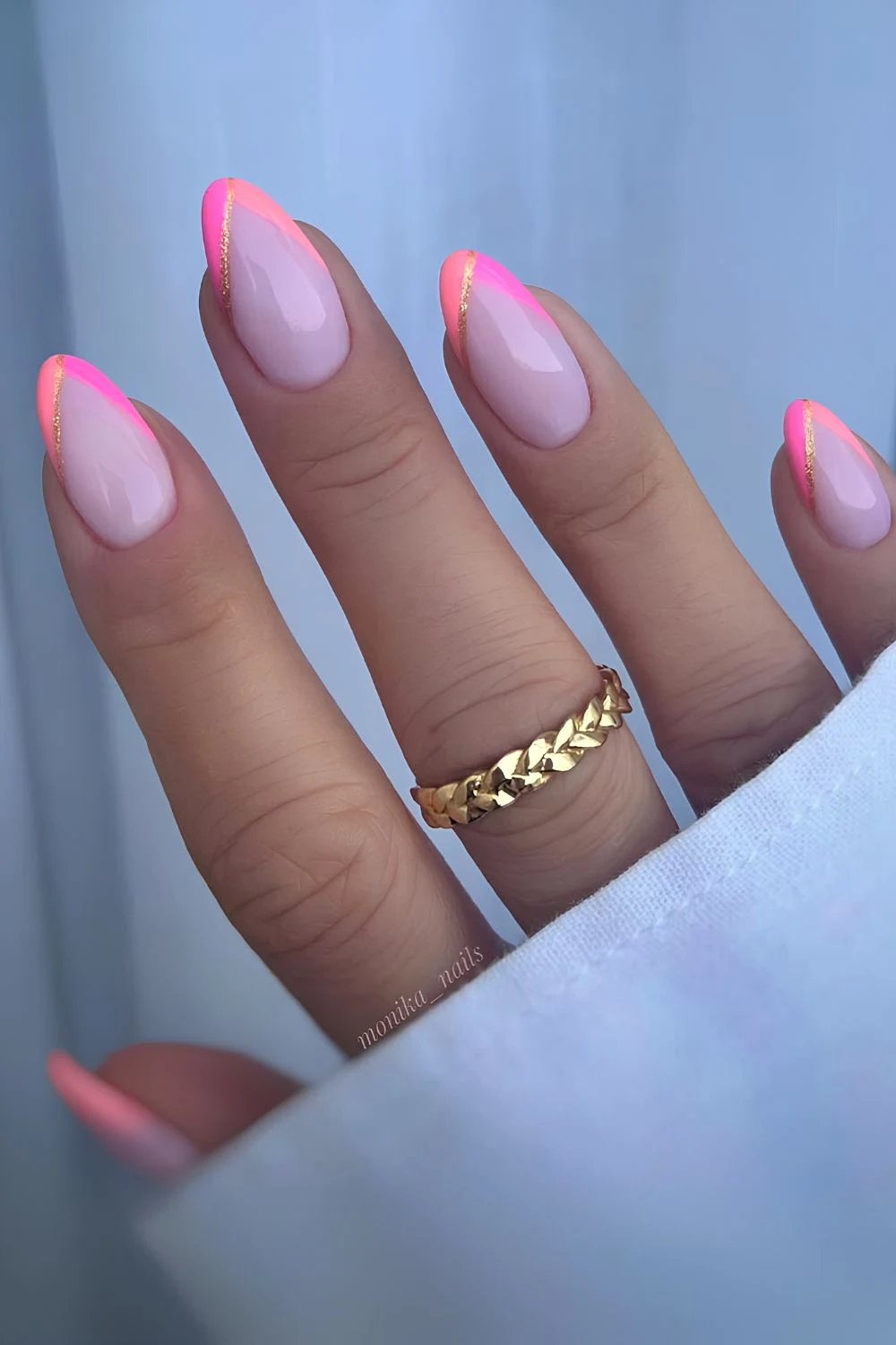 Pink and orange French mani with glitter accents