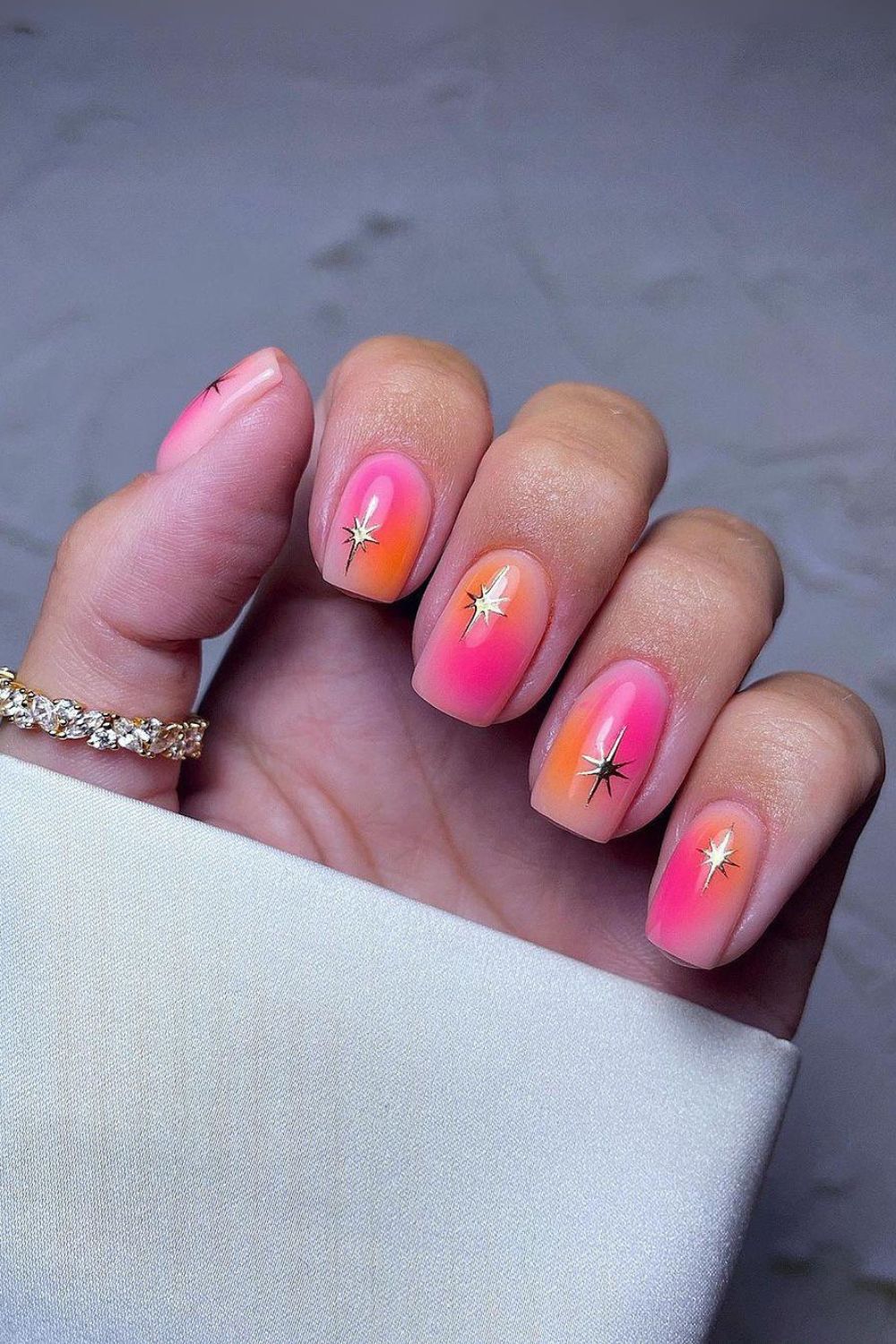 Pink and orange celestial nails