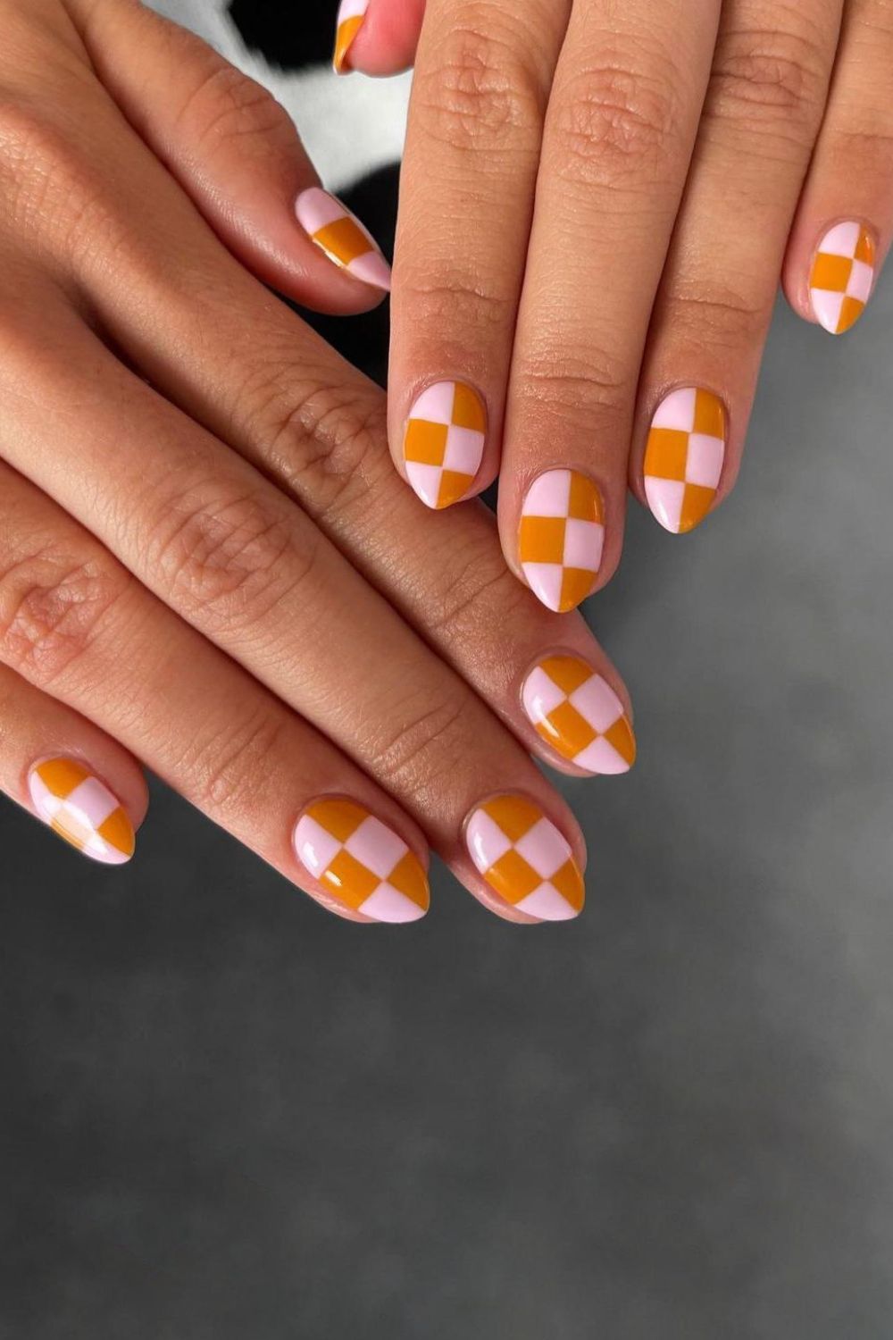 Pink and orange checkerboard nails