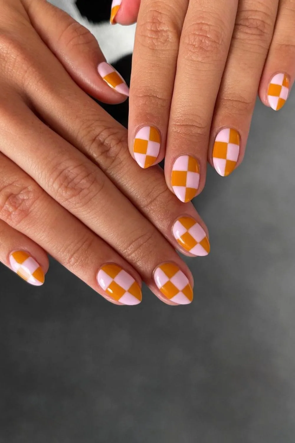 Pink and orange checkerboard nails