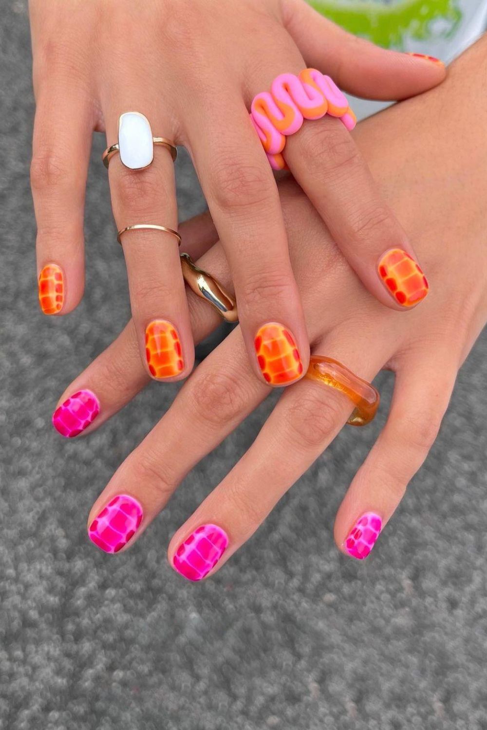 Pink and orange croc print nails